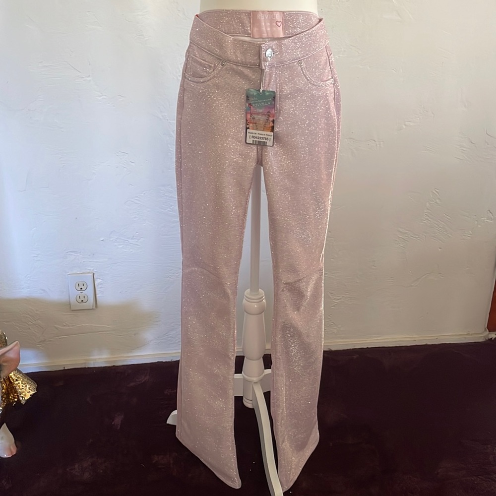 Pink sparkling pants.